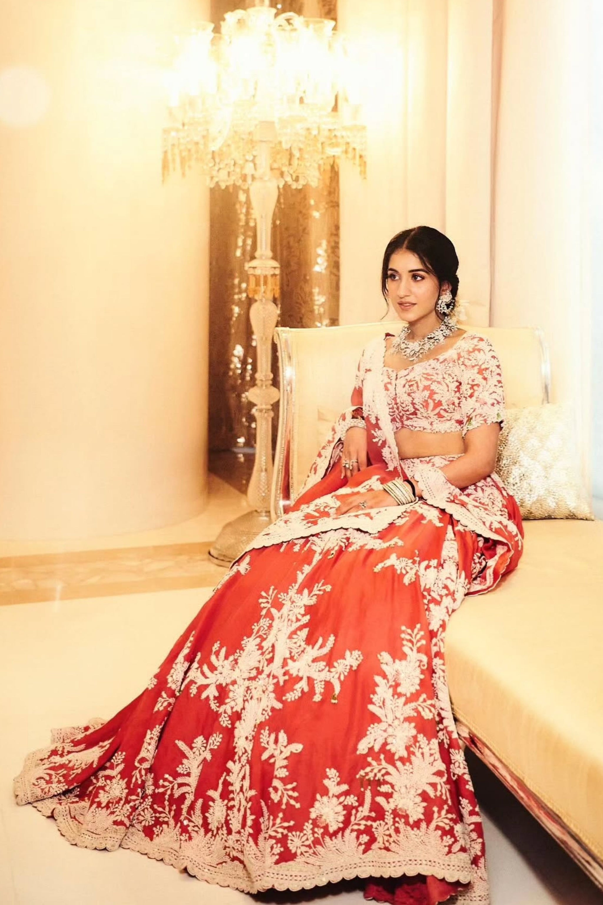radhika merchant orange dress Radhika Merchant radiates in a vibrant pink-orange gown, exuding a mix of contemporary elegance and festive charm. Her dazzling presence captivates everyone, showing how a perfect blend of fashion and color can