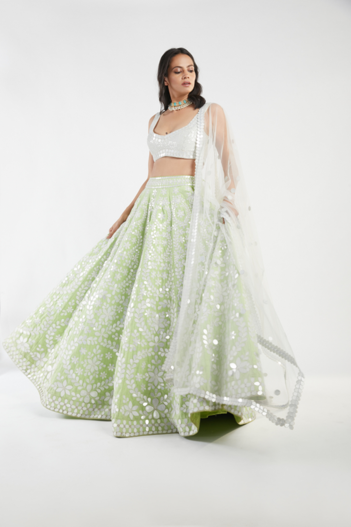 Ivory and green lehenga set