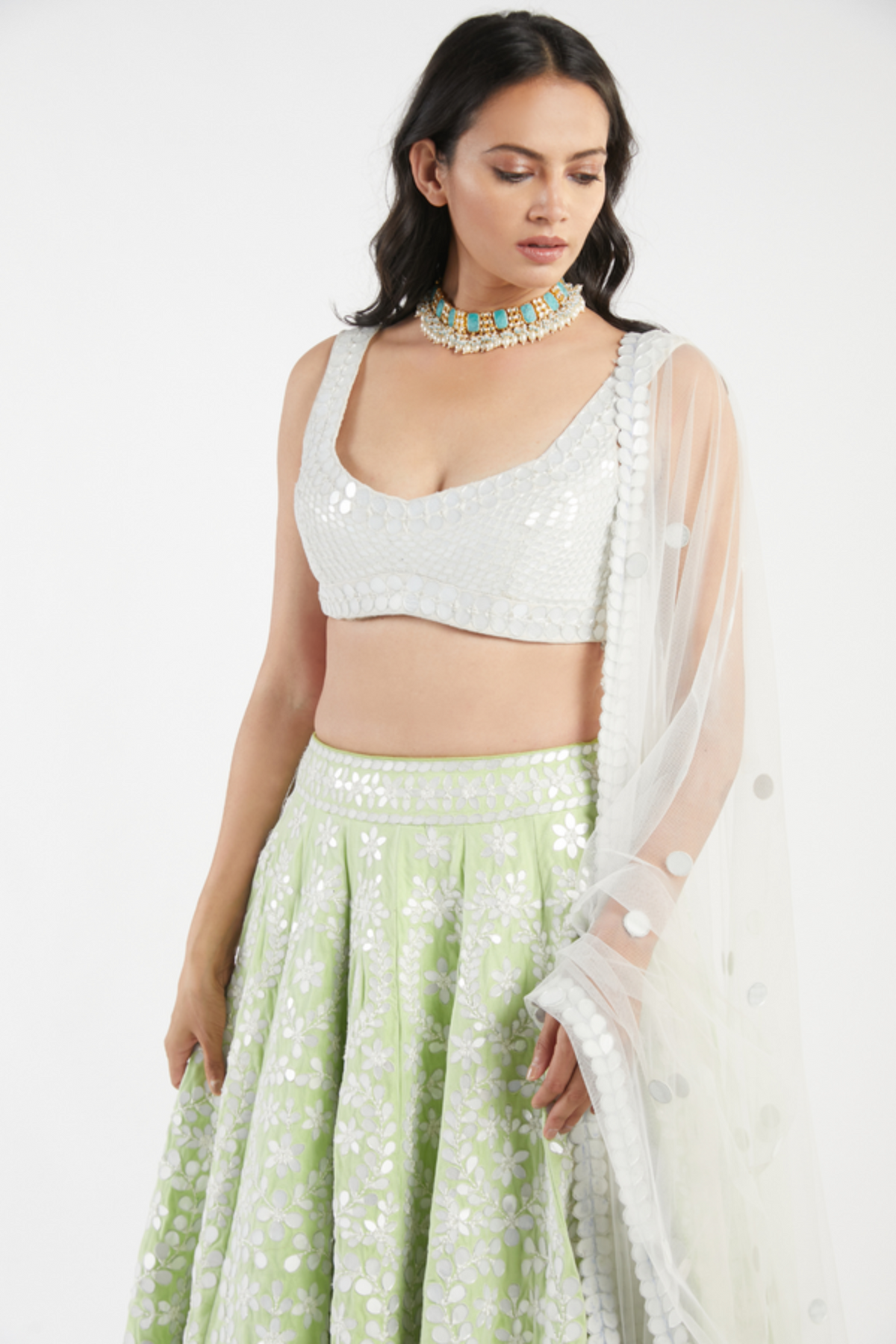 Ivory and green lehenga set