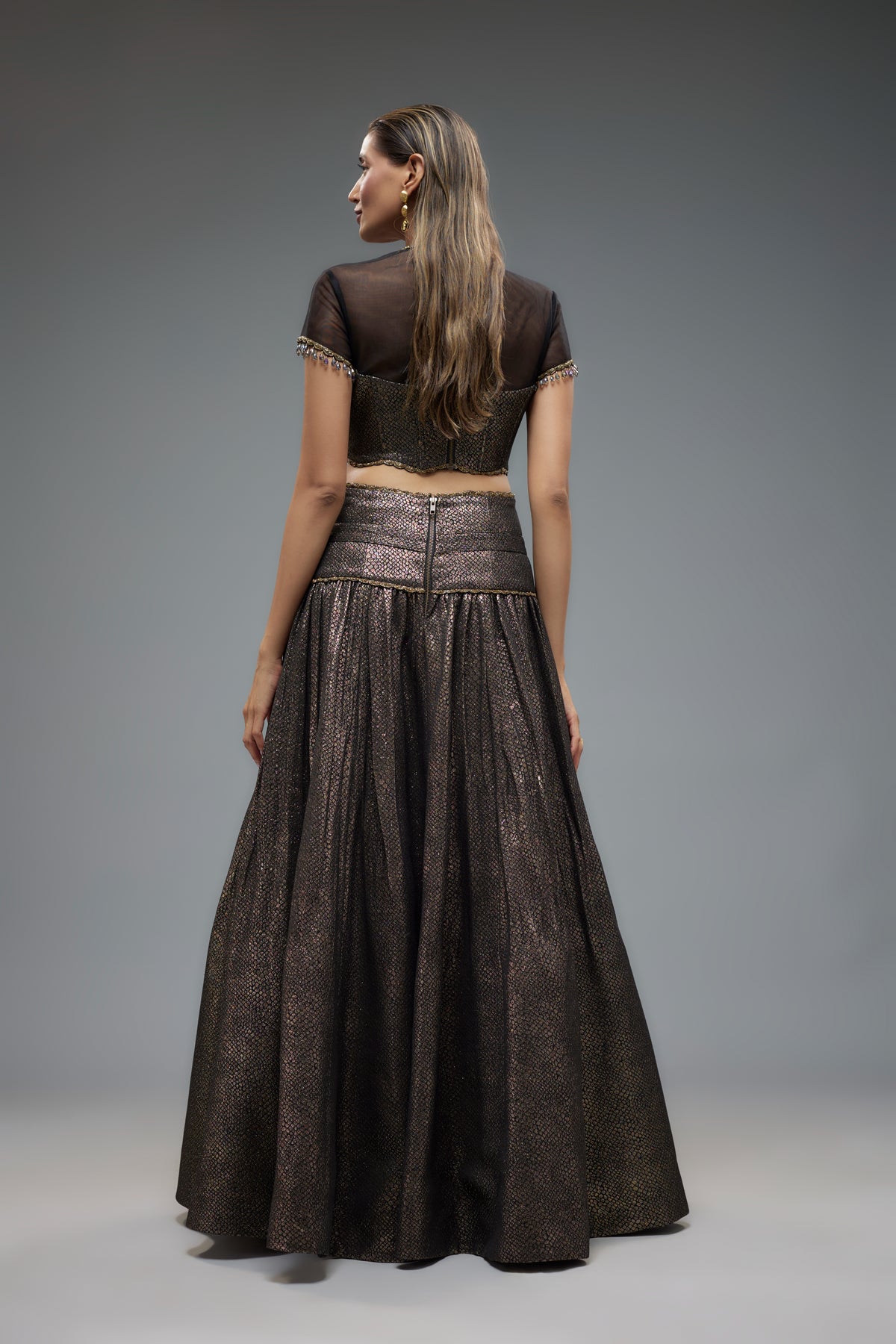 Sheer Blouse and Gold Lehenga