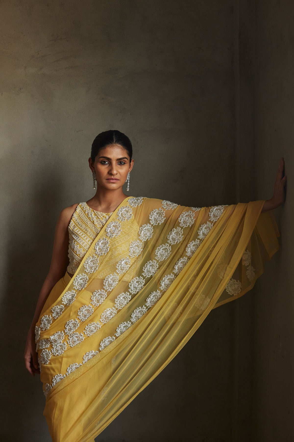 Yellow pleated saree and blouse