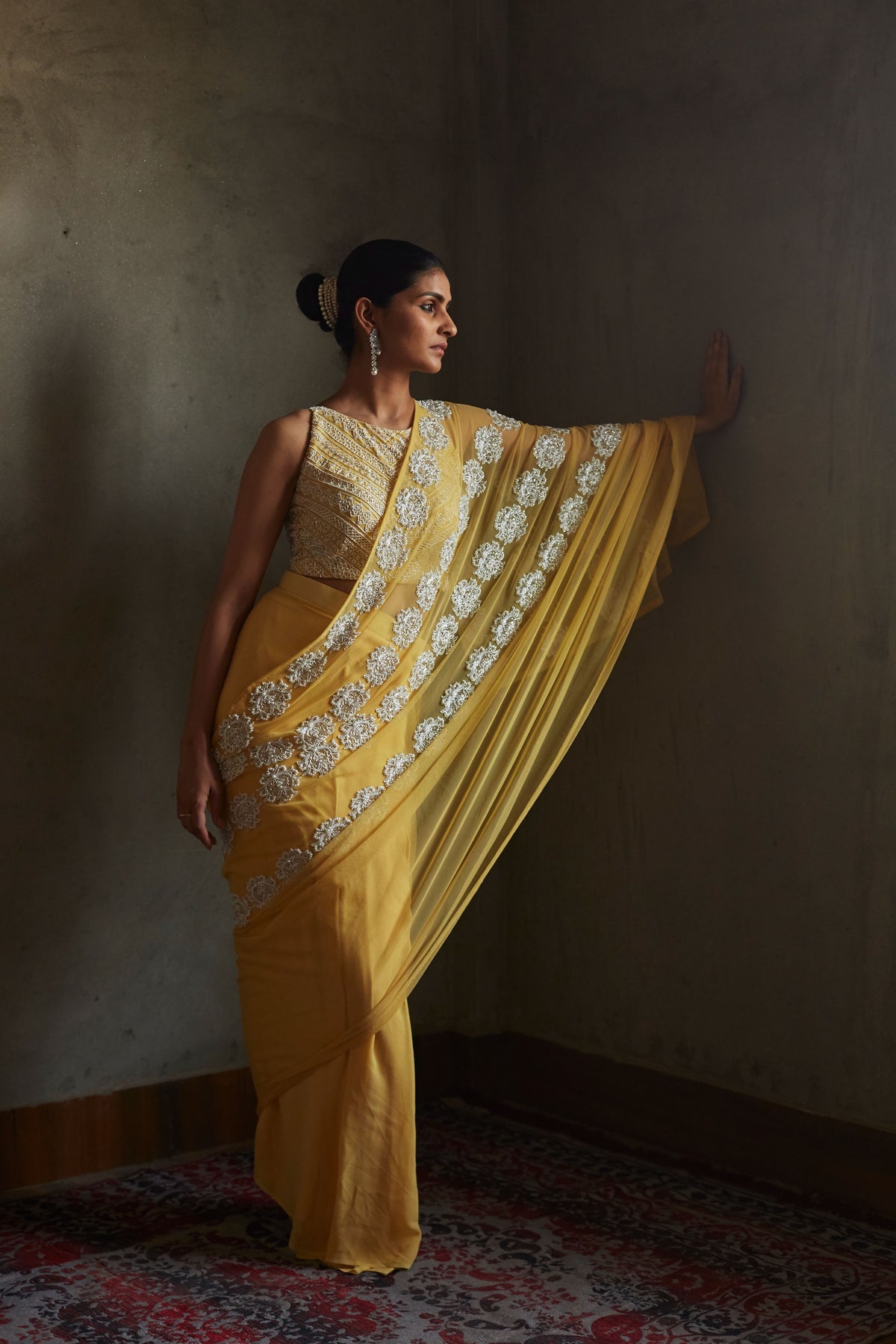 Yellow pleated saree and blouse