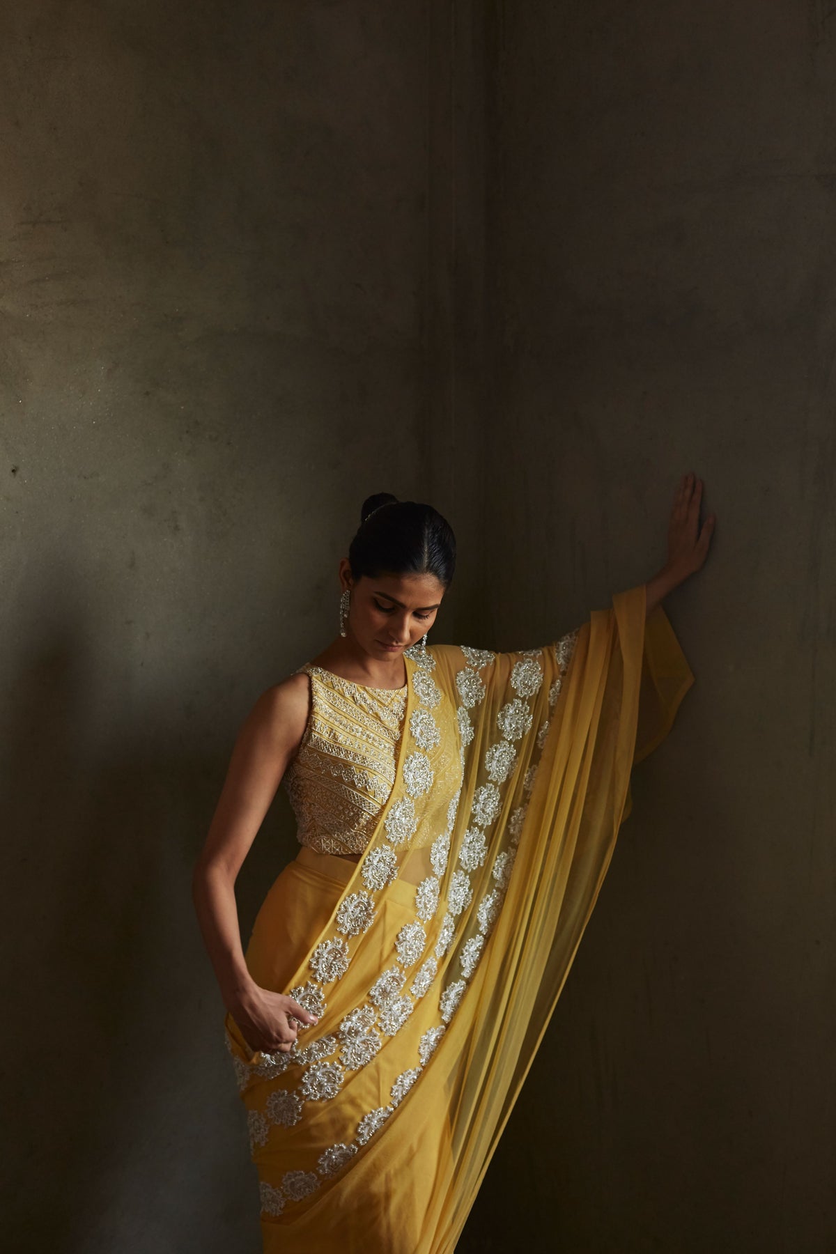 Yellow pleated saree and blouse