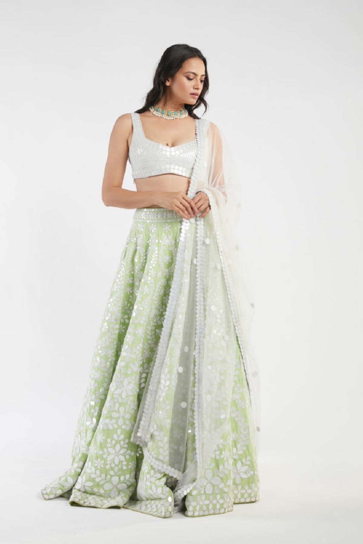 Ivory and green lehenga set