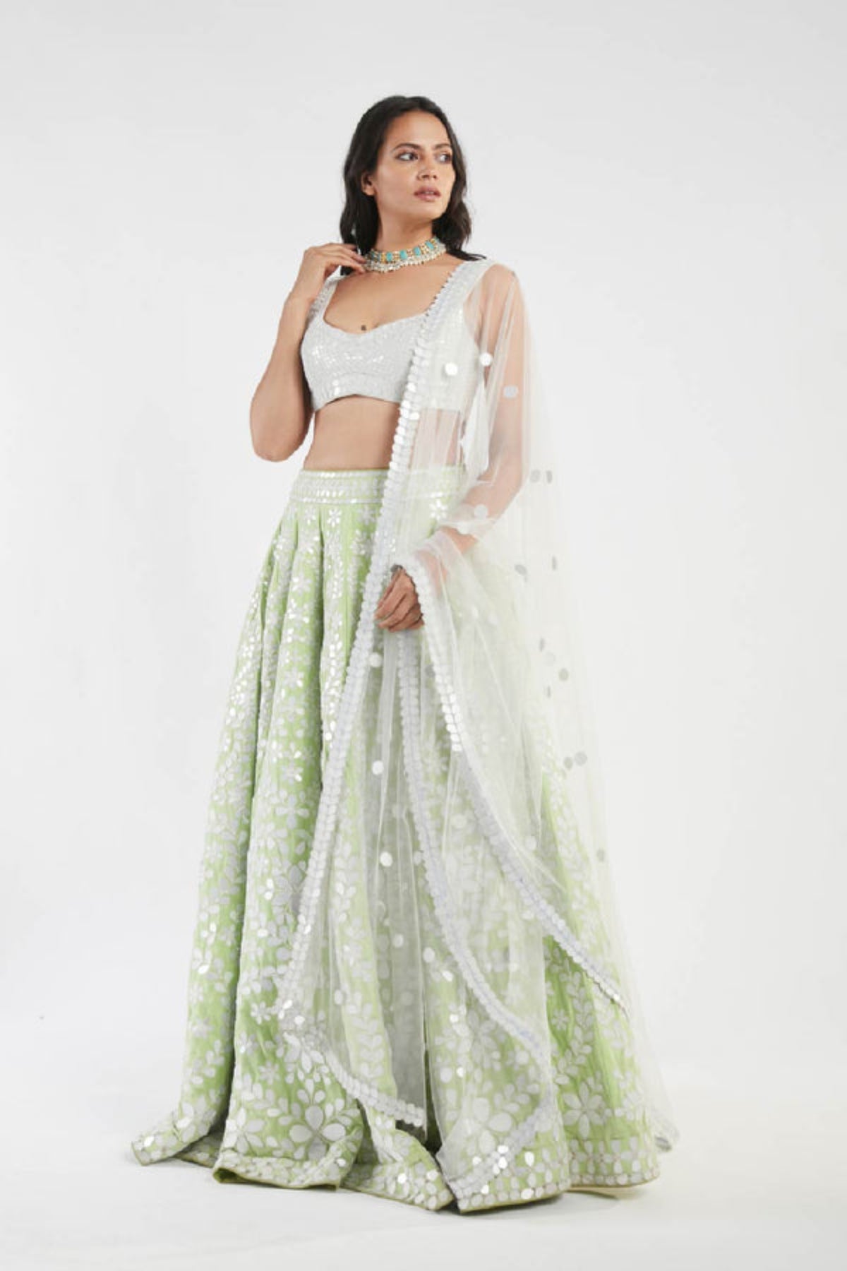 Ivory and green lehenga set