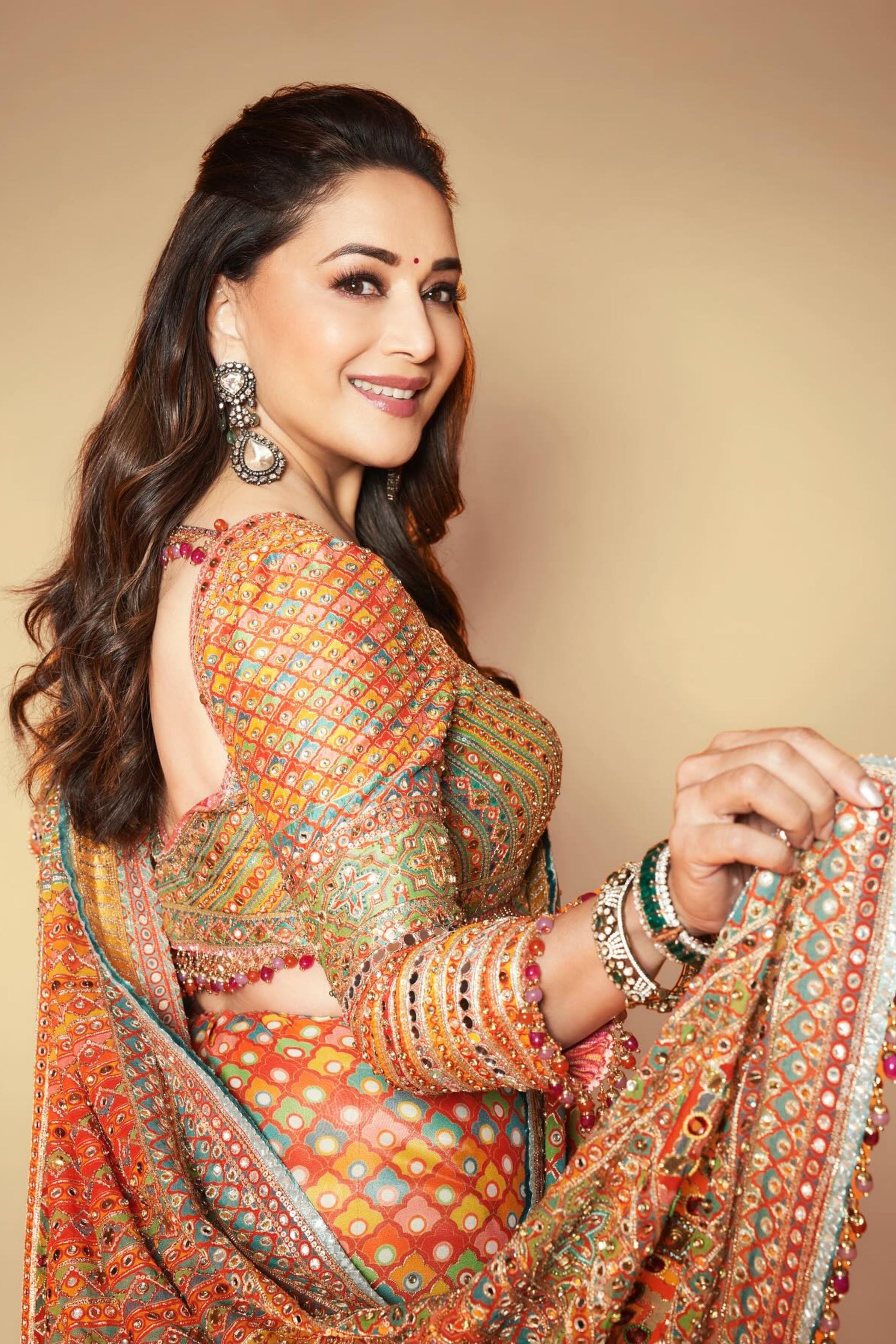 madhuri dixit orange dress Timeless Grace! Madhuri Dixit Nene Dazzles in a Vibrant Floral Orange Saree