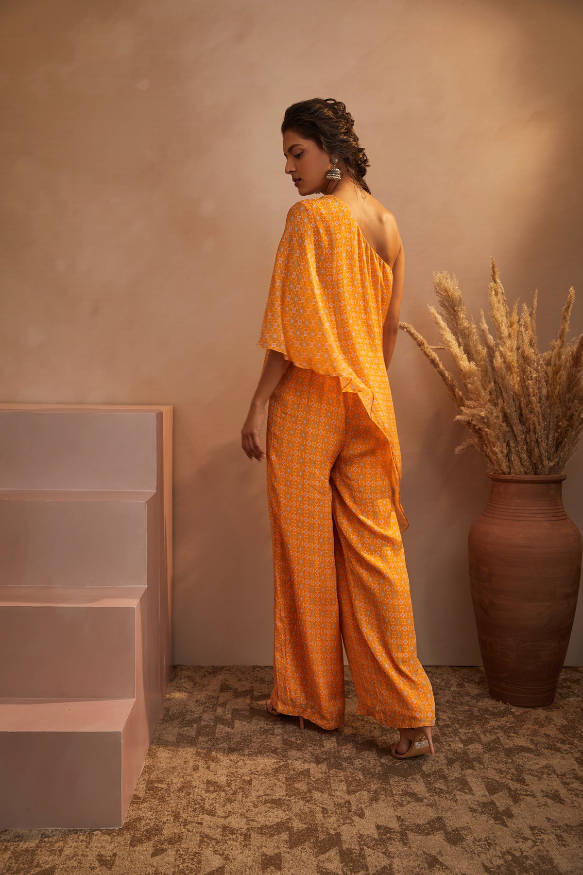 Mustard printed one shoulder jumpsuit