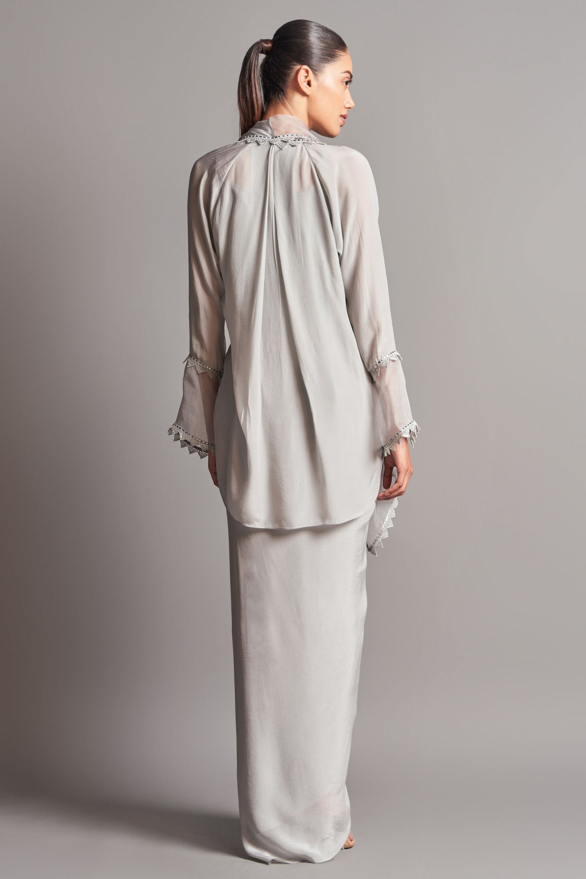 Shawl collar cape with draped skirt