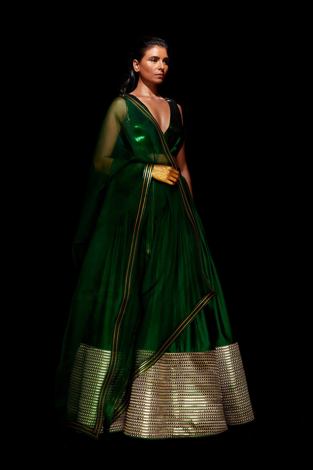 Hand woven metallic lehenga in green