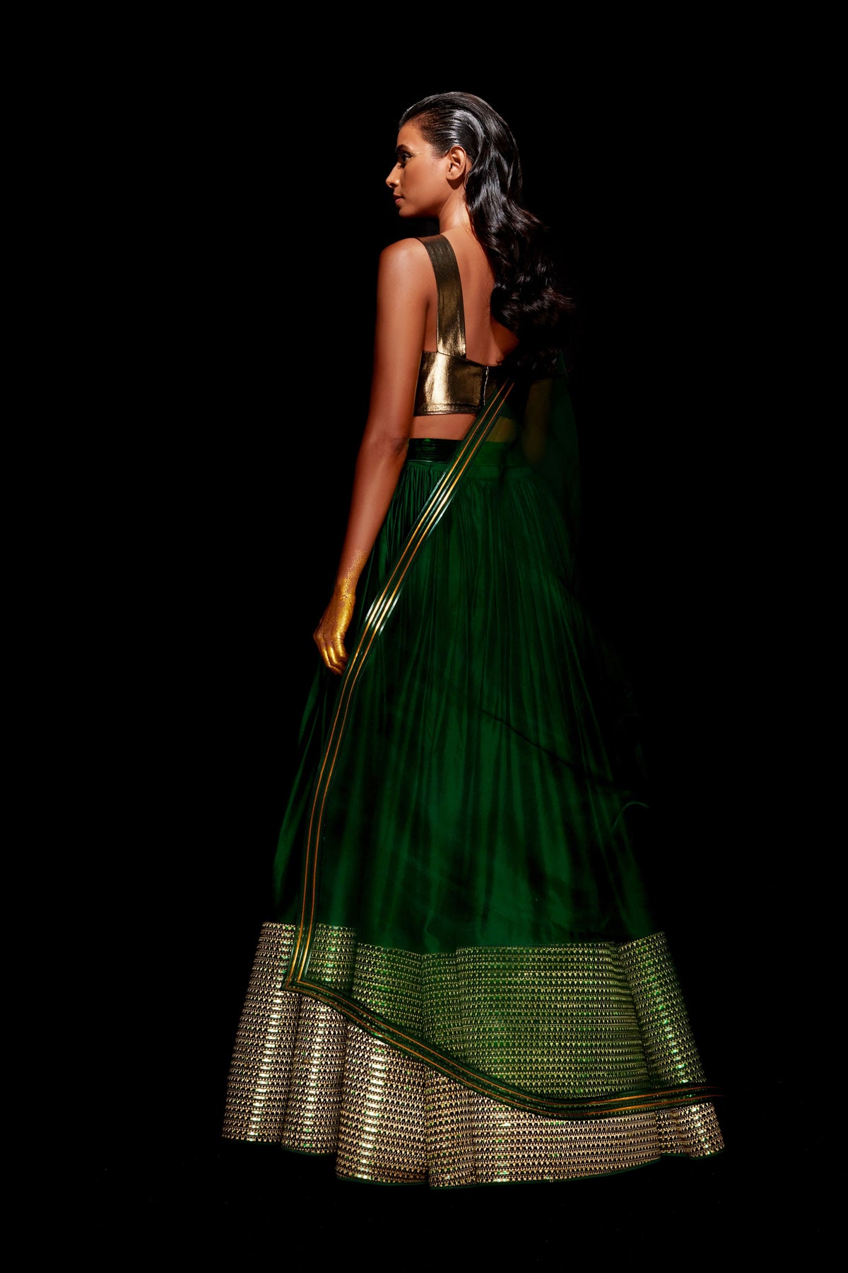 Hand woven metallic lehenga in green