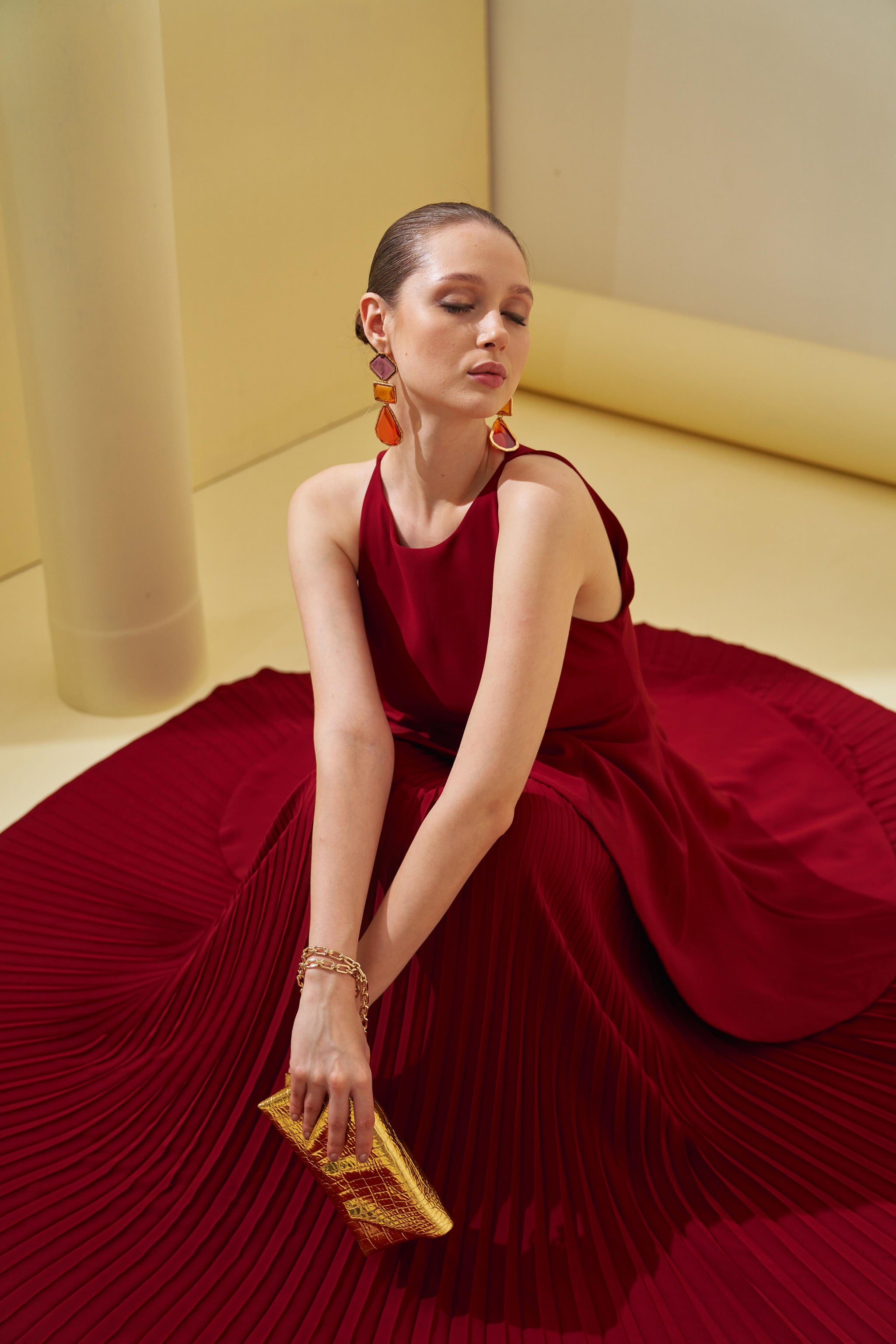 Pleats by Aruni - Maroon Peplum Pleated Gown Pleats by Aruni - Maroon Peplum Pleated Gown