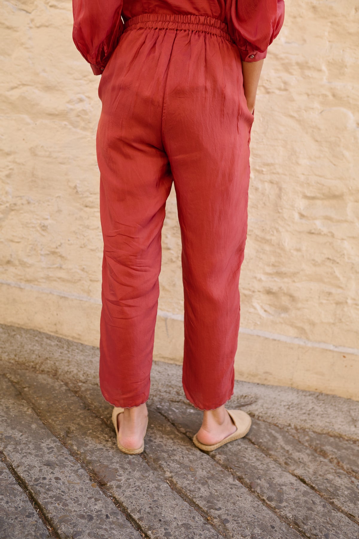 Pull on striper trousers with pockets and scalloped hem