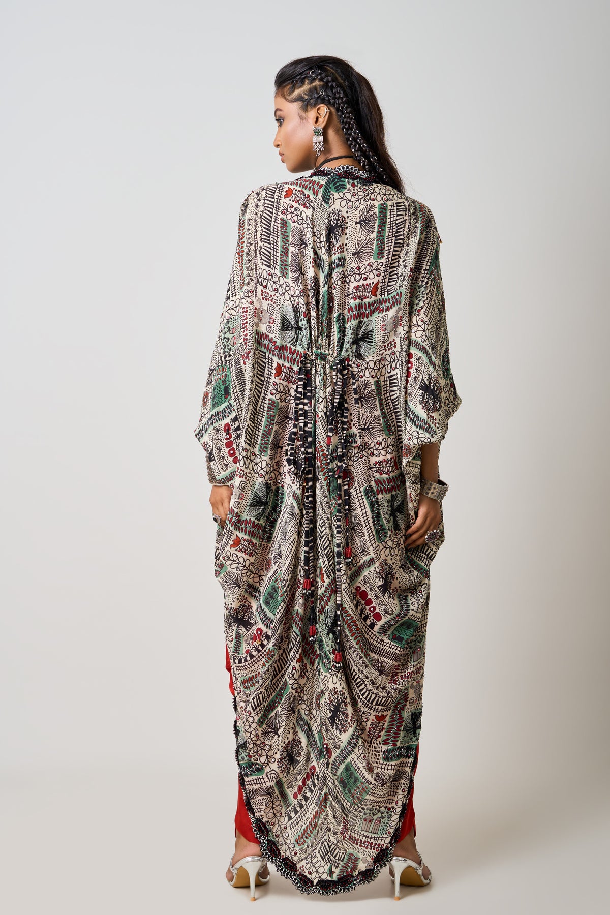 Orange Jumpsuit With Mint Cape