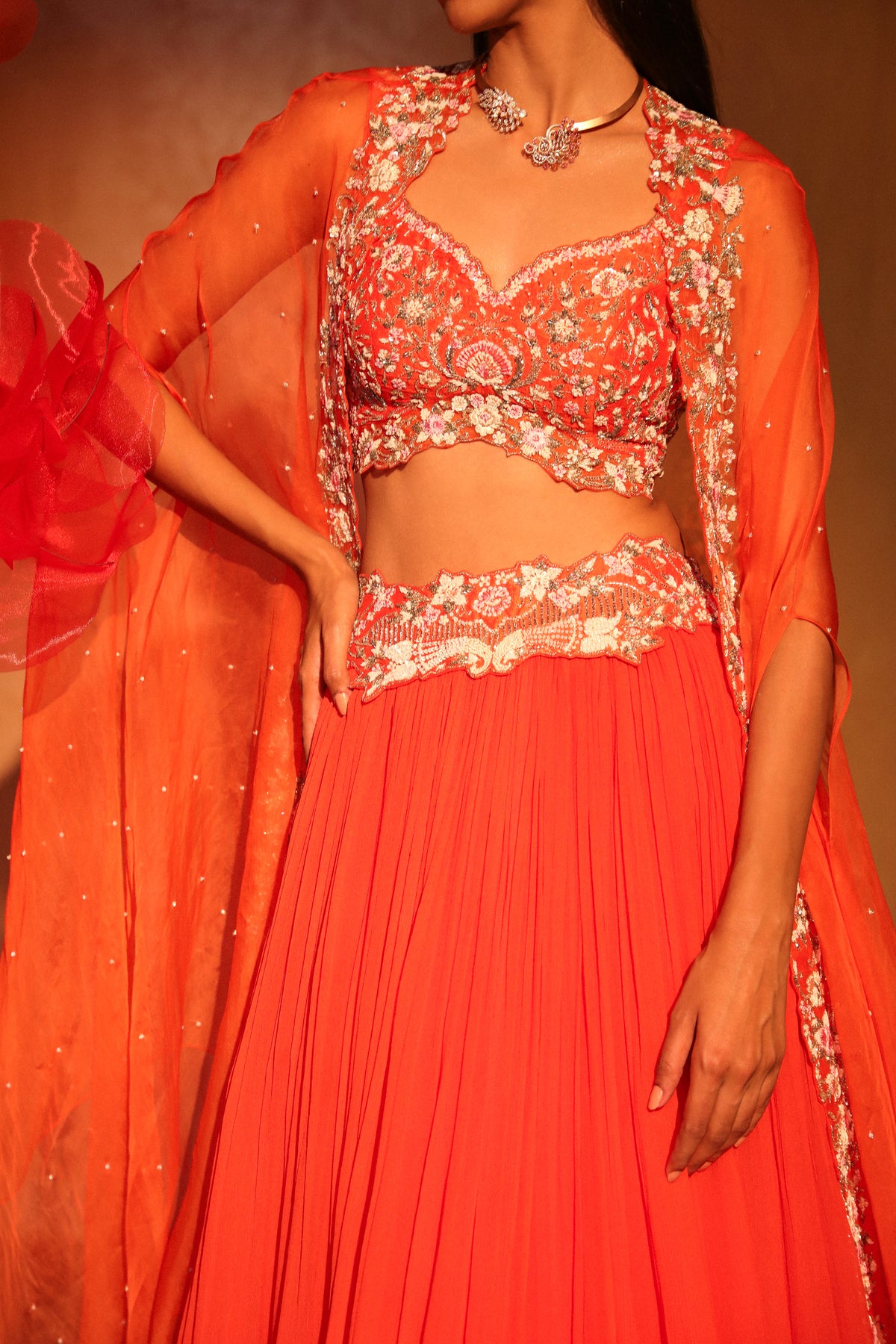 Glamorous orange lehenga and cape set