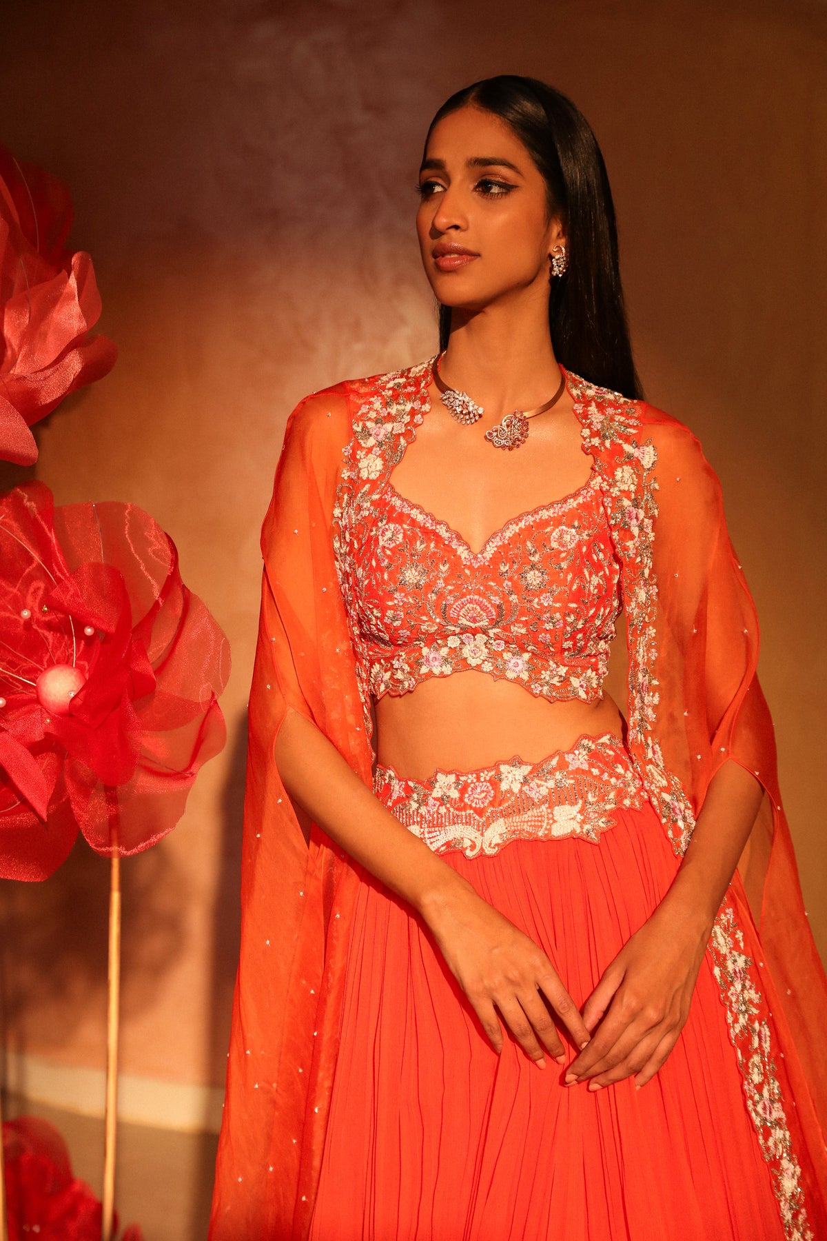 Glamorous orange lehenga and cape set