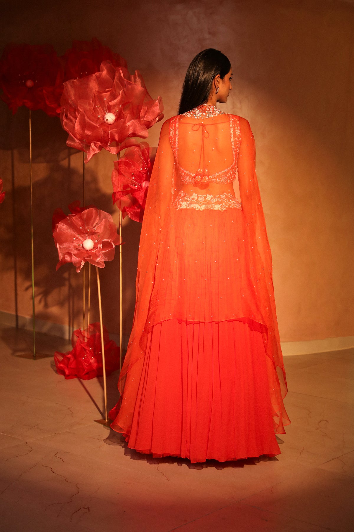 Glamorous orange lehenga and cape set