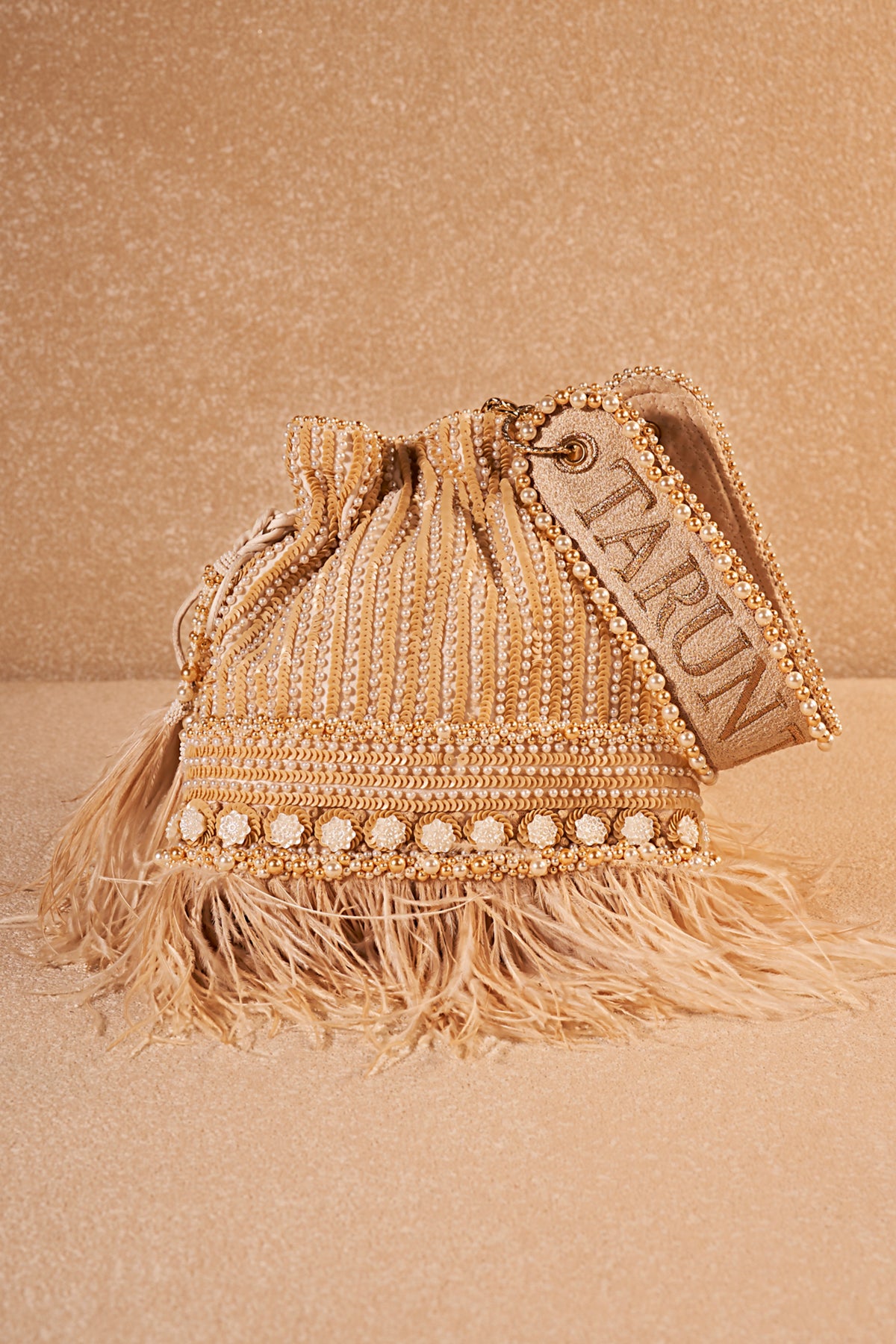 Ivory Embroidered Potli With Feather
