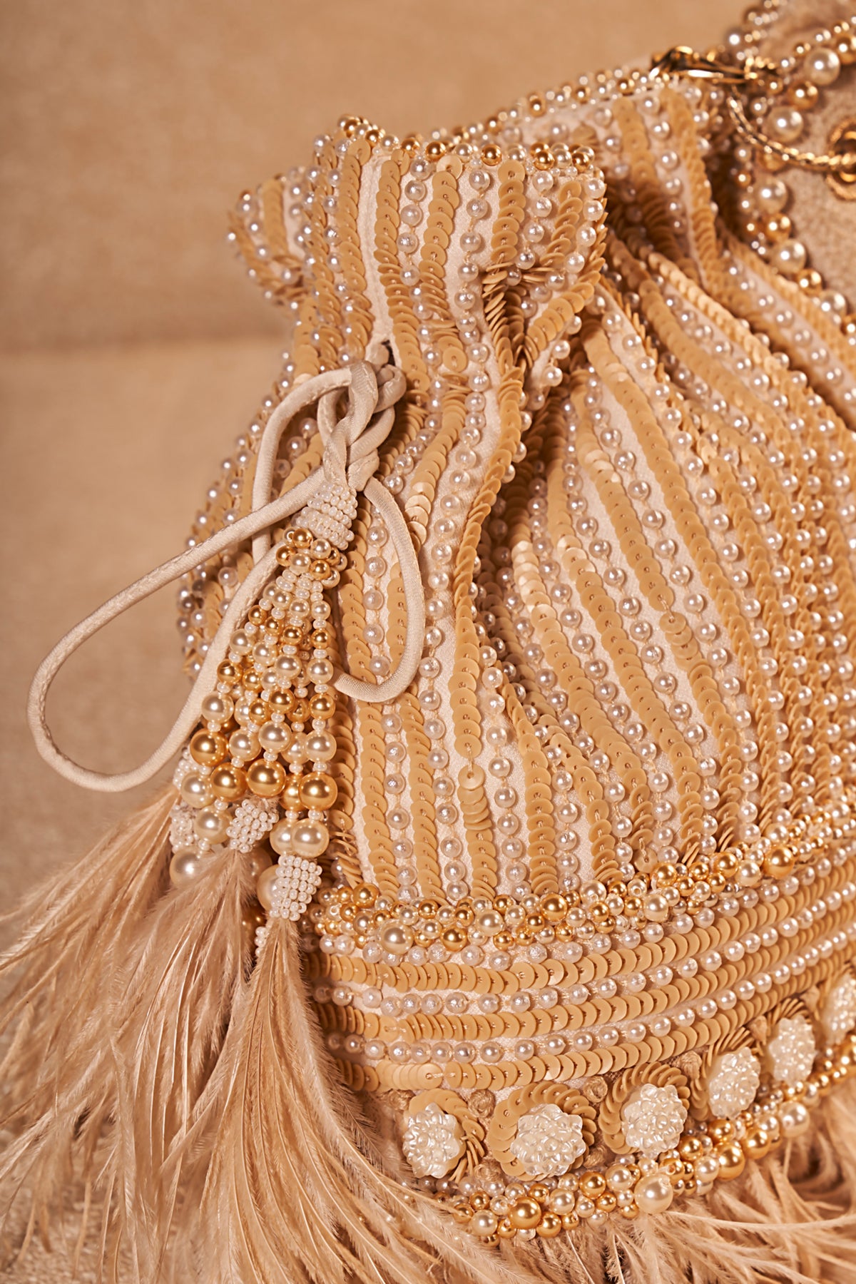 Ivory Embroidered Potli With Feather
