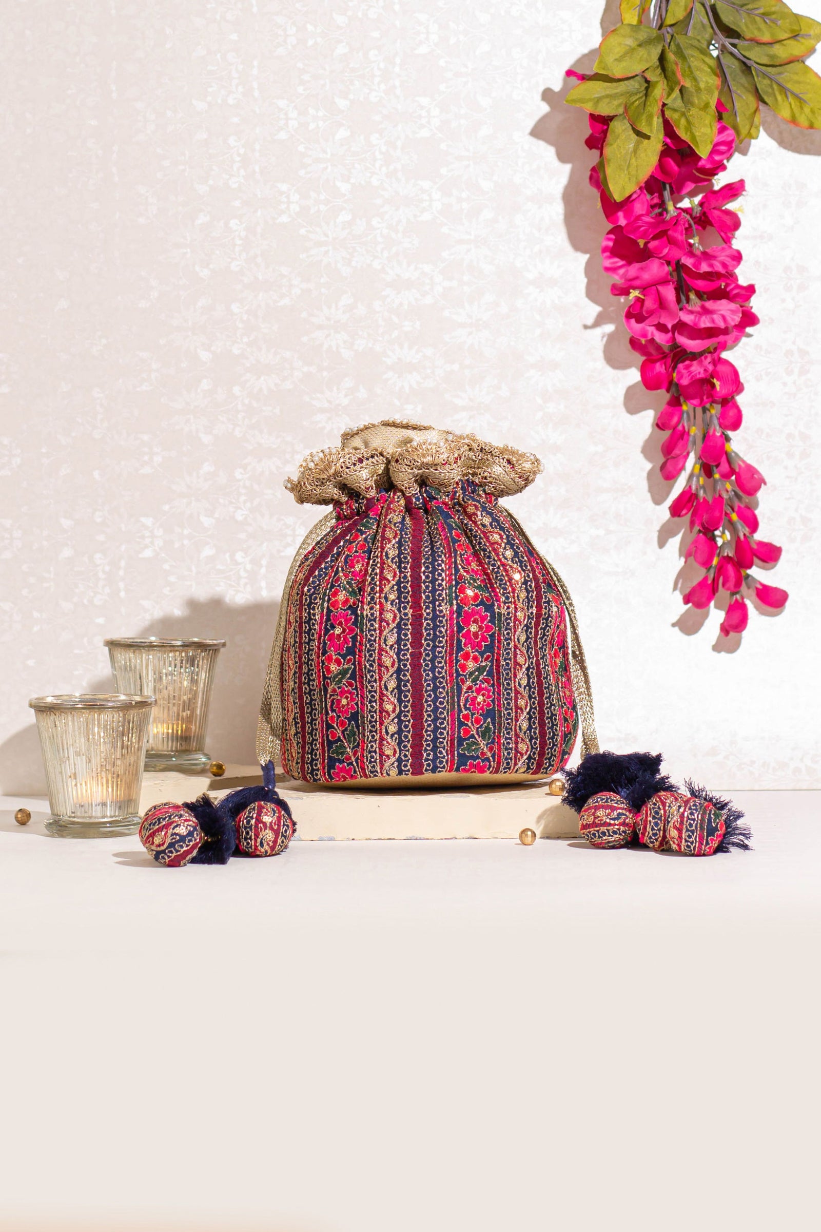 Buy Gold Embellished Sequin Potli Bag by Amyra Online at Aza Fashions.