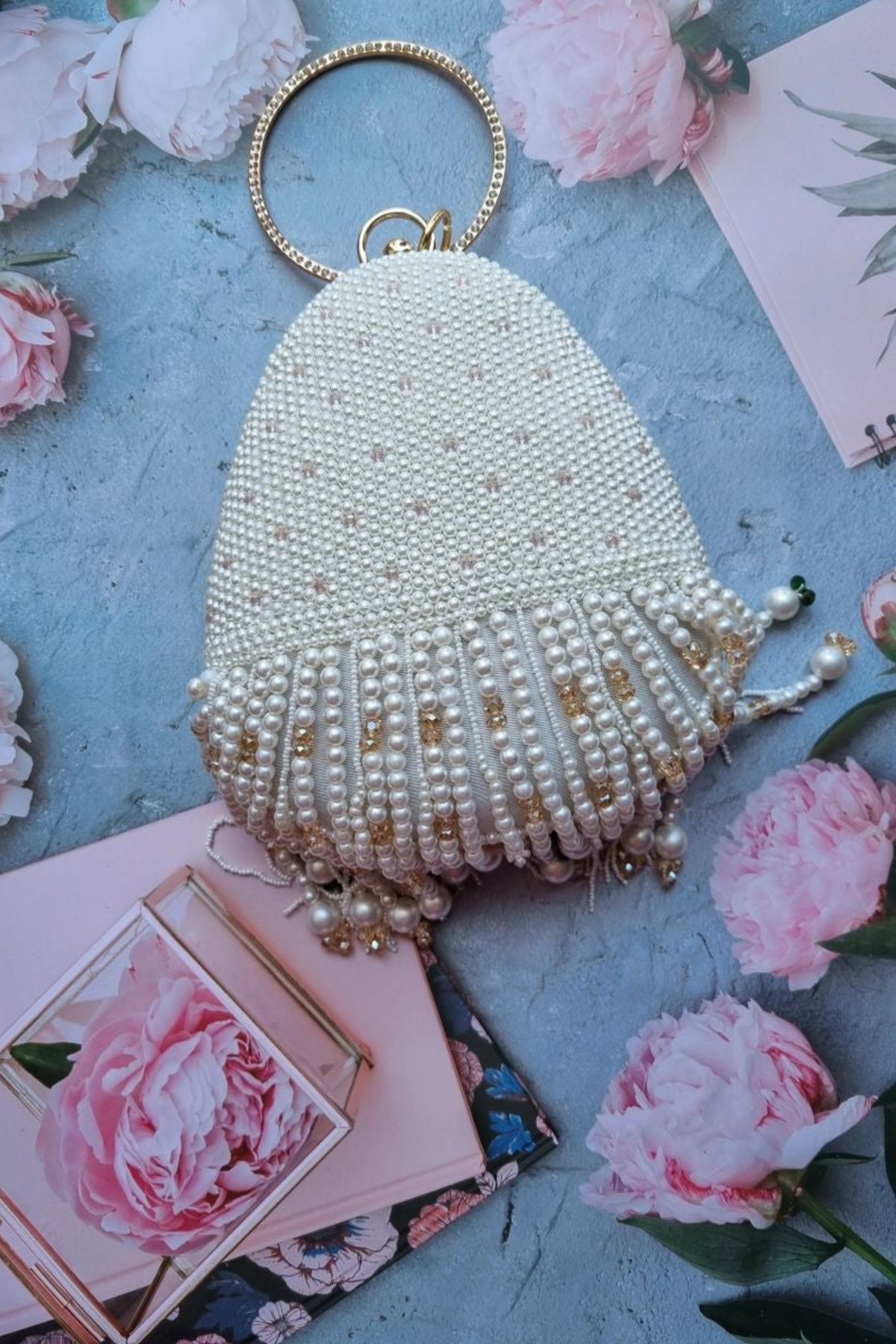 La perle handembroidered tassel clutch